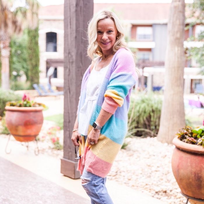 Another reviewer wears the sweater, this time in soft, muted rainbow colors that offer a different, more subtle take on the look.