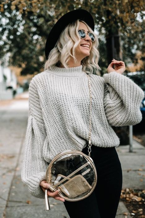 Another reviewer wearing the sweater in a soft light grey shade