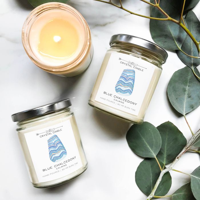 a candle with a soothing stone embedded inside