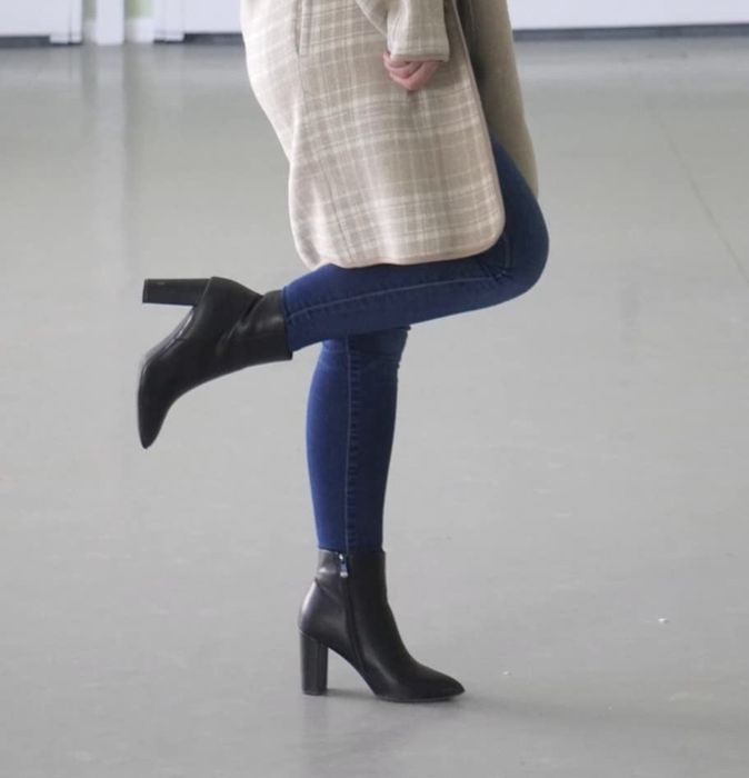 The reviewer is wearing black booties.