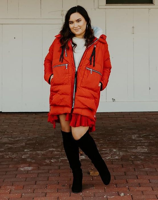 A reviewer rocking the red coat.