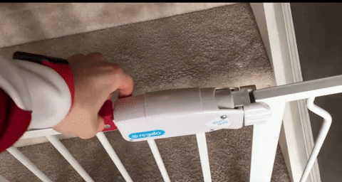 A reviewer’s gif demonstrating how to easily open the door latch with just one hand.