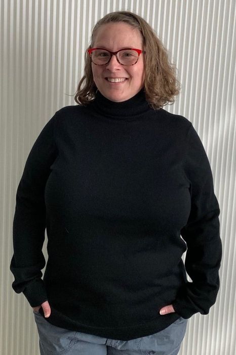 Reviewer wearing a black sweater
