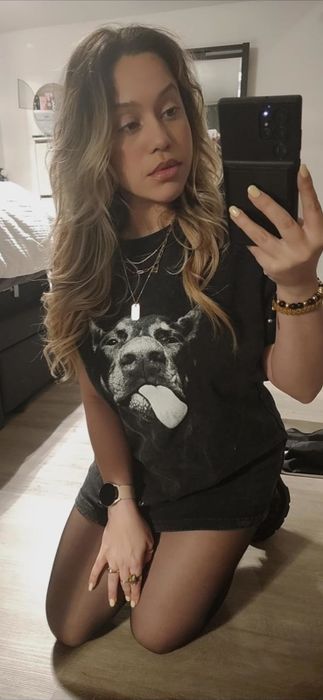 A reviewer rocking the dog-themed tee.