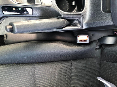 A review showing seat gap fillers in use between car seats.