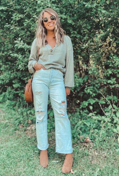 A reviewer shares her look in an army green shirt, highlighting its style.
