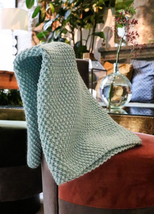 a knitted blue blanket