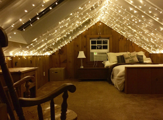 the ceiling of a room covered in string lights