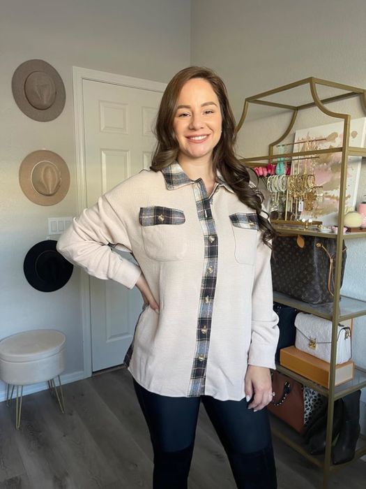 The reviewer is styled in an apricot shacket.
