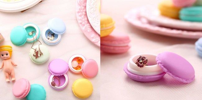 The containers in shades of blue, pink, green, and yellow, filled with jewelry