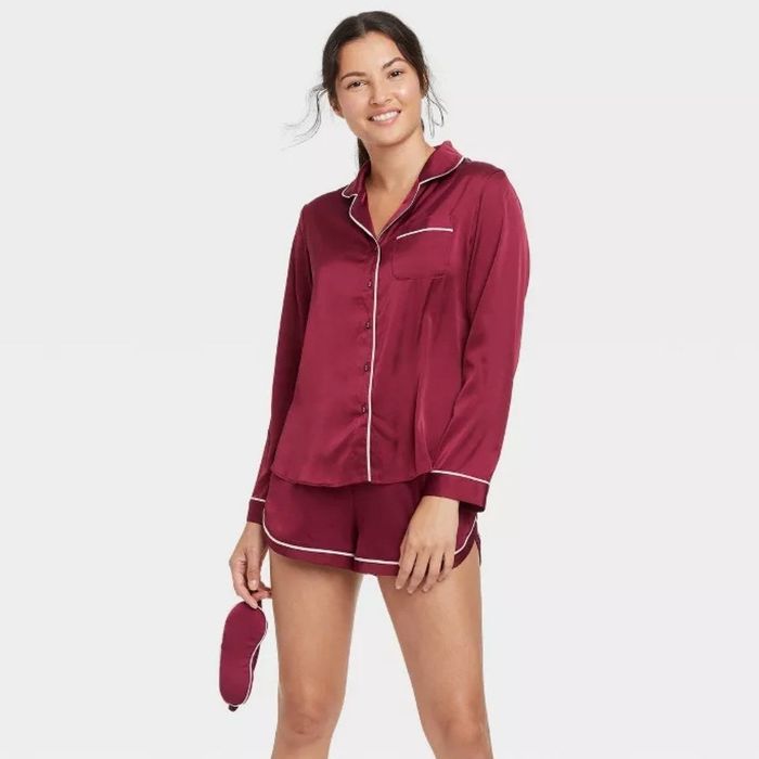 A model wearing the red shorts set