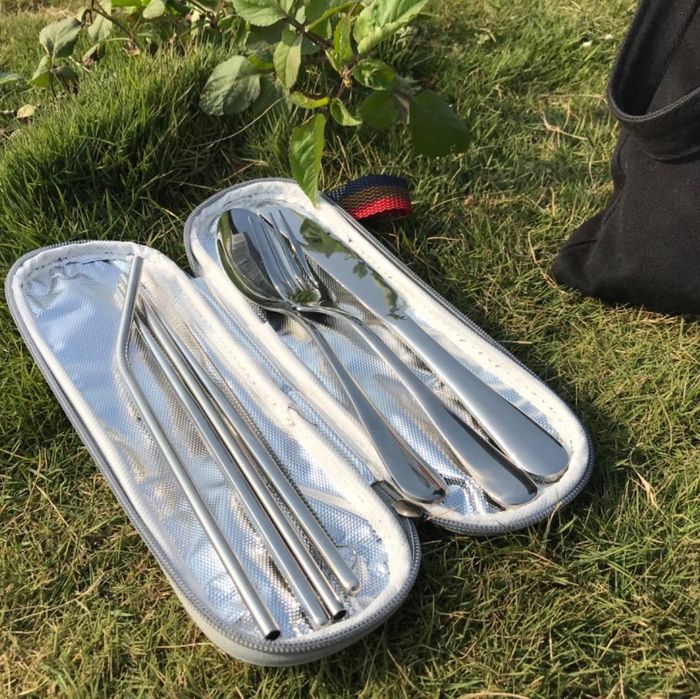 The felted case opens to reveal a durable stainless steel fork, knife, spoon, two straws, a pair of chopsticks, and a straw-cleaning brush.