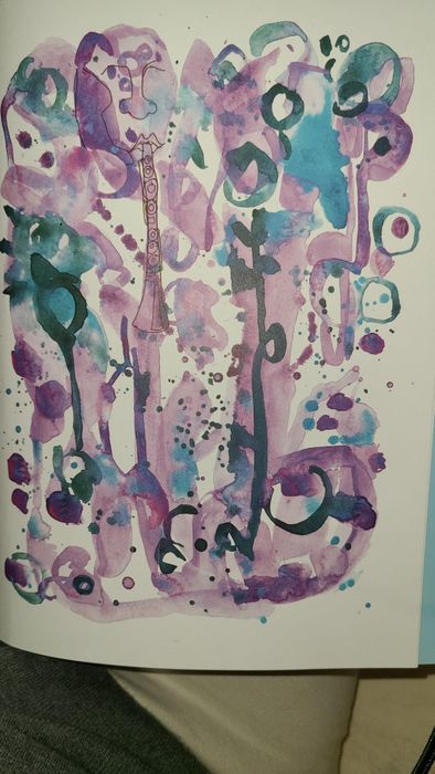 An abstract watercolor masterpiece with fluid, swirling shapes and patterns, blending shades of blue and purple.