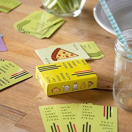 A few cards from the game deck laid out on a table.