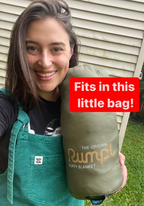 The author with the blanket packed into its stuff sack, captioned: