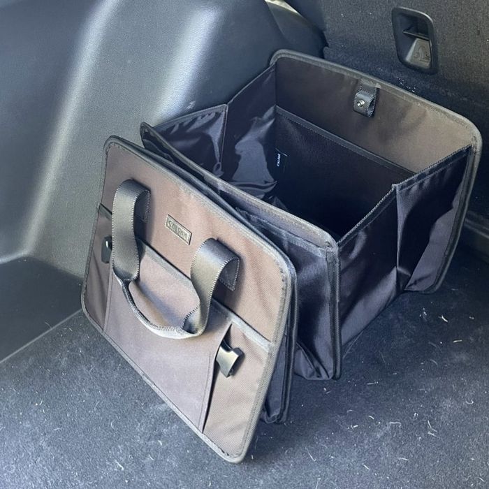 An empty Calpak Car Organizer, waiting to be filled with essentials.