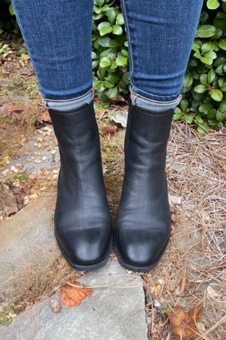 a reviewer photo of someone outside, dressed in jeans and black ankle boots