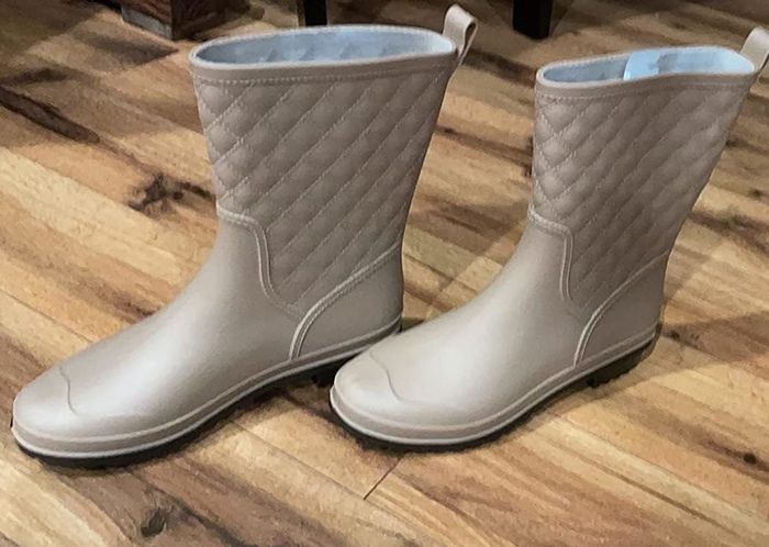 A reviewer shares a photo of the quilted rain boots in tan.