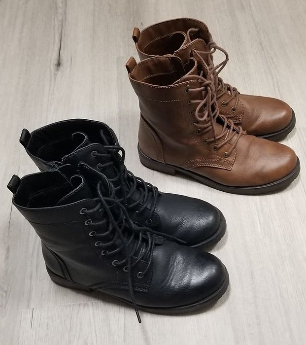 a reviewer photo of black combat boots paired with brown combat boots