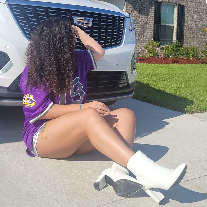 A reviewer donning a jersey, shorts, and pristine white booties.