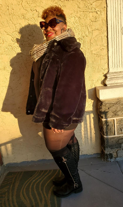 another reviewer wearing black quilted boots