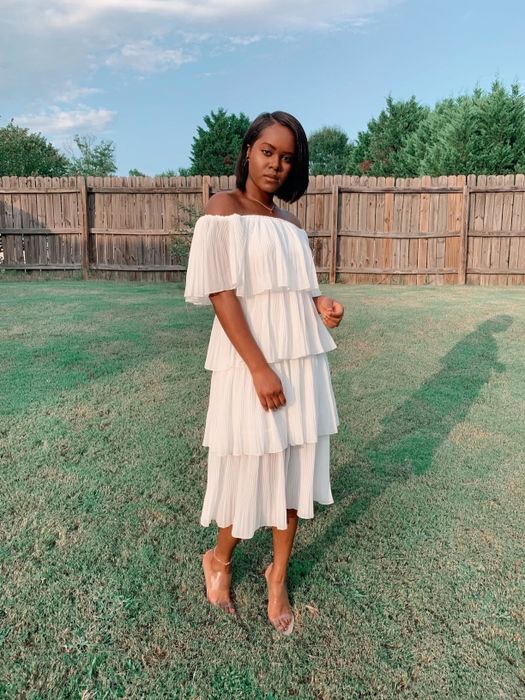Reviewer wearing the beige chiffon off-the-shoulder party dress