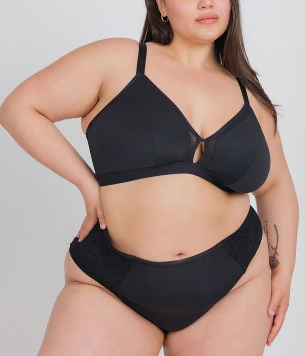 The model is wearing a black bra.