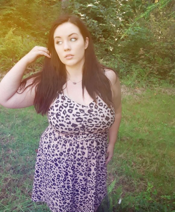 A reviewer wearing the leopard print cotton beach dress.