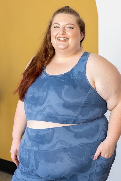 Another model is modeling the blue marble print bra.