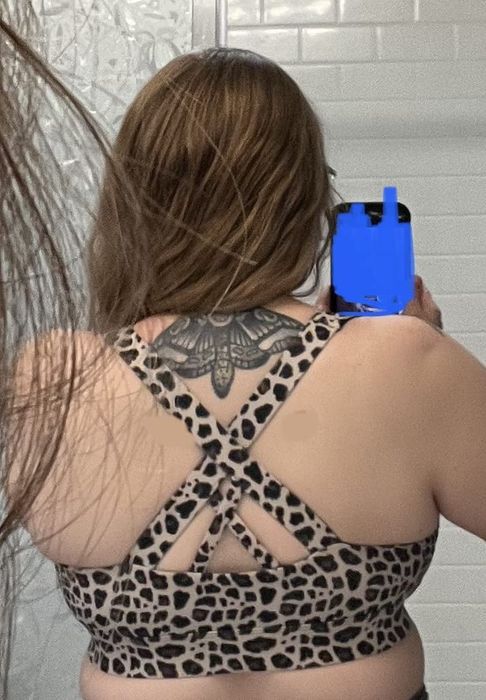 the back view of the cheetah print bra model