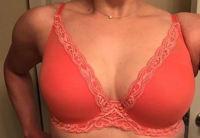 Reviewer image showing them wearing the orange bra