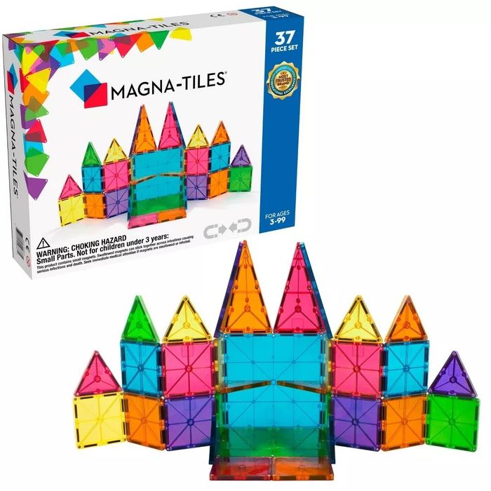 A vibrant collection of Magna-Tiles arranged like a castle, with the packaging visible alongside.