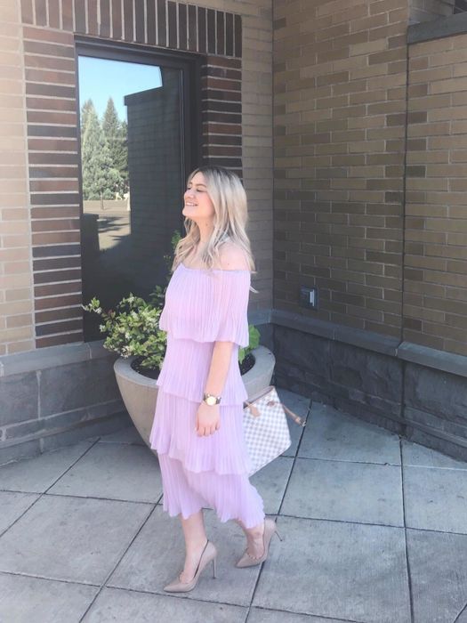 Reviewer sporting the purple chiffon off-the-shoulder party dress