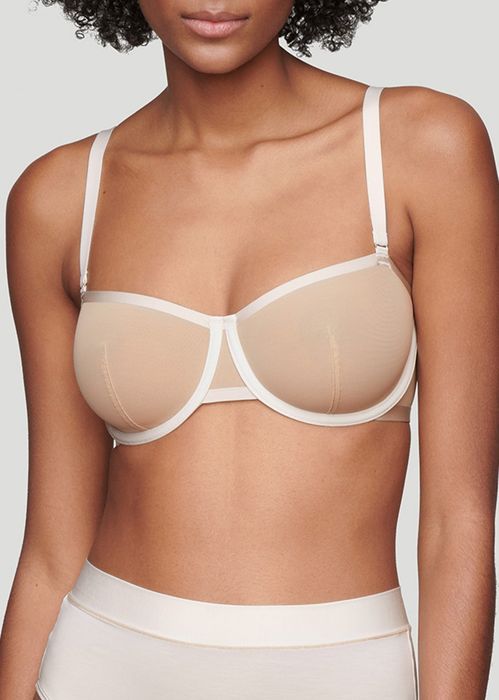A bra featuring a nude and white contrast design.