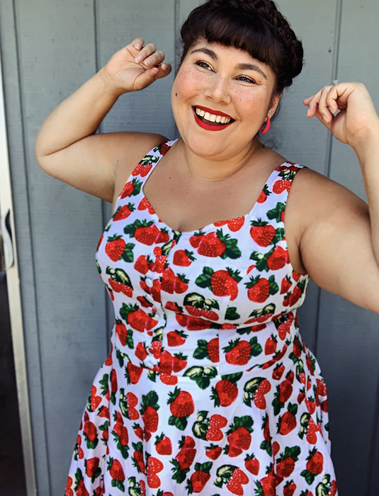 Reviewer wearing the strawberry sleeveless flared A-line dress