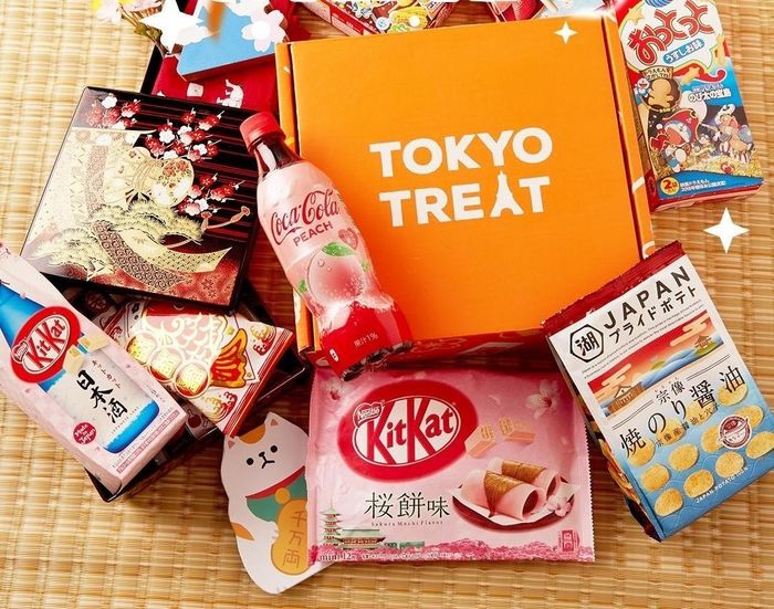 An orange box labeled 'TokyoTreat,' filled with an exciting selection of snacks from Japan.