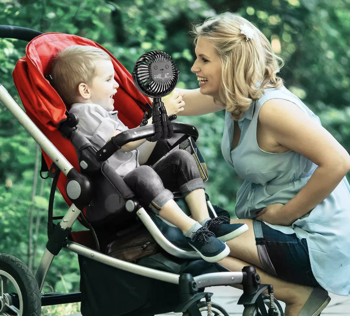 Flexible stroller fan clipped onto the stroller handle