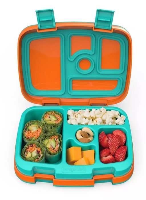 An orange and teal bento box opened up to reveal a colorful, delicious lunch inside.