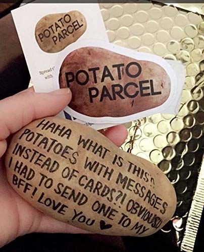 An image showcasing a message written on a potato from Potato Parcel.