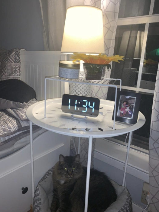 A customer photo featuring the clock on their nightstand