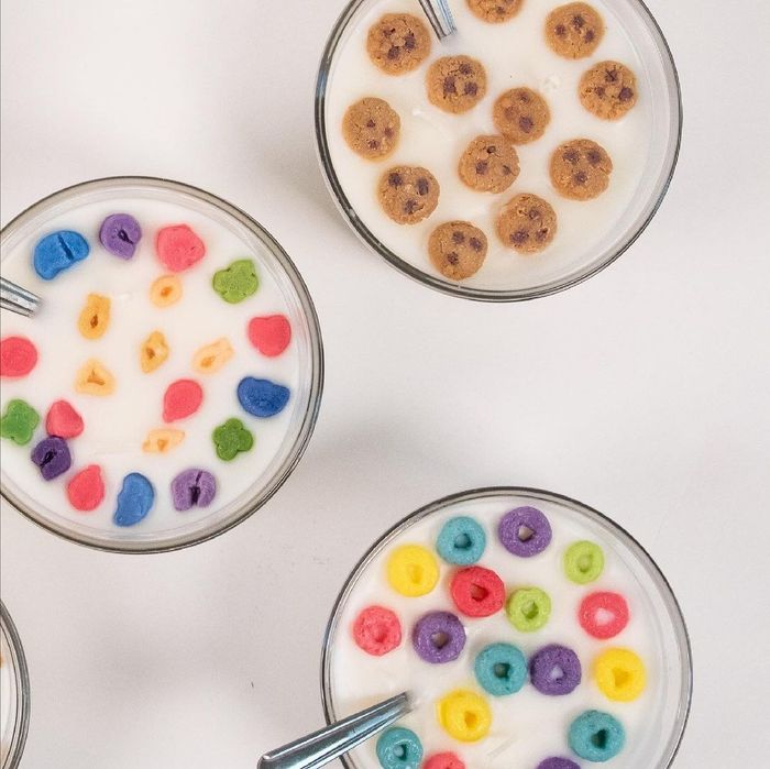 Three glass bowls filled with wax designed to mimic milk and cereal.