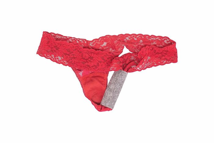 The pads placed on a thong, resembling a pantyliner in appearance