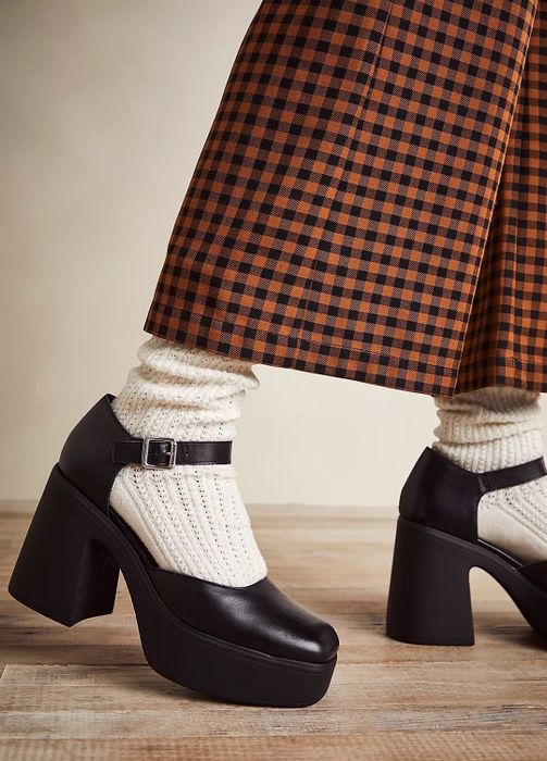 Model rocking black mary jane heels paired with socks