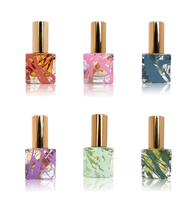 A collection of six perfume bottles in different shades