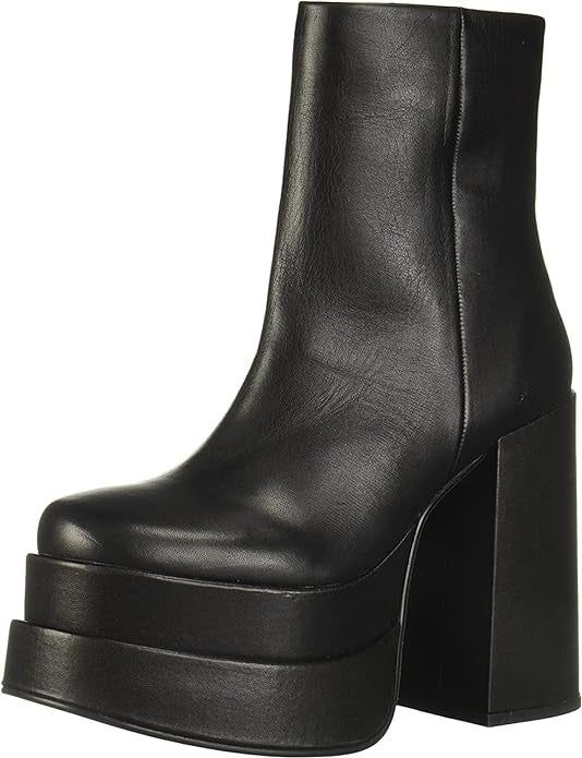 A pair of black platform ankle boots.
