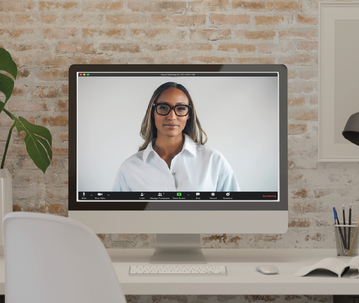 The model is positioned in front of a computer screen, showcasing how the robe appears as a standard dress shirt from the top half.