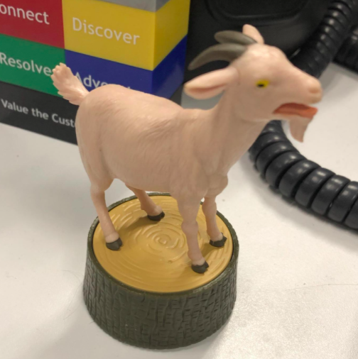 A customer photo featuring the screaming goat figurine