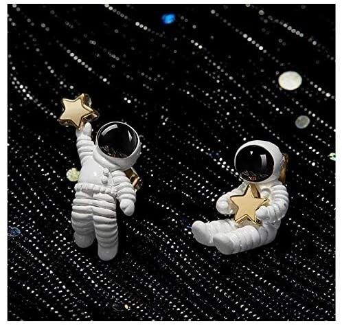 The earrings displayed against a sparkling backdrop