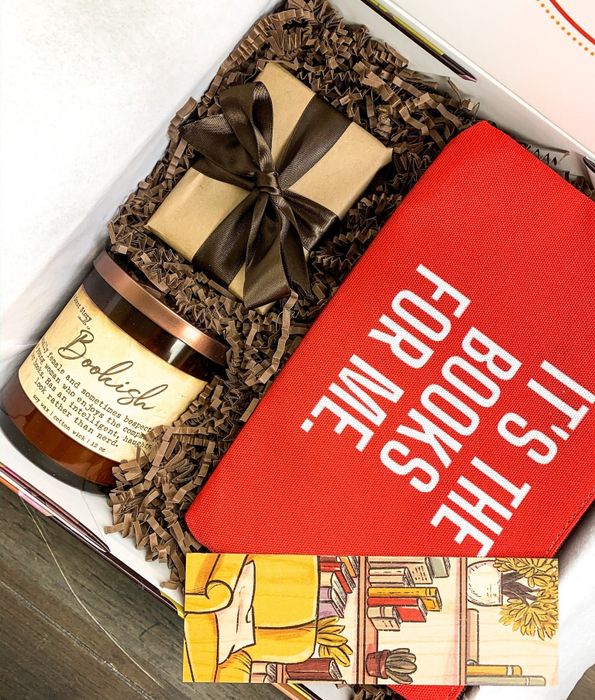 A gift box filled with a variety of book-themed surprises