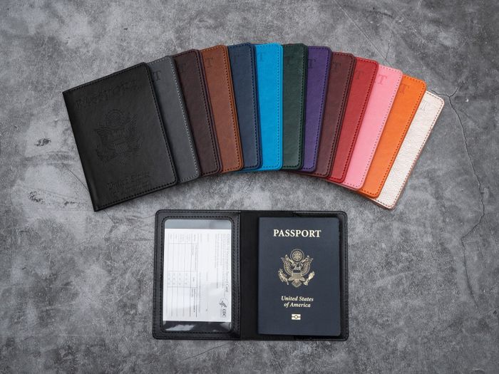 A variety of passport and vaccination card holders in different colors